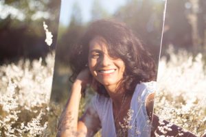 woman in mirror outside