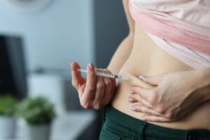woman injecting shot