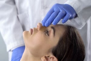 Woman with broken nose